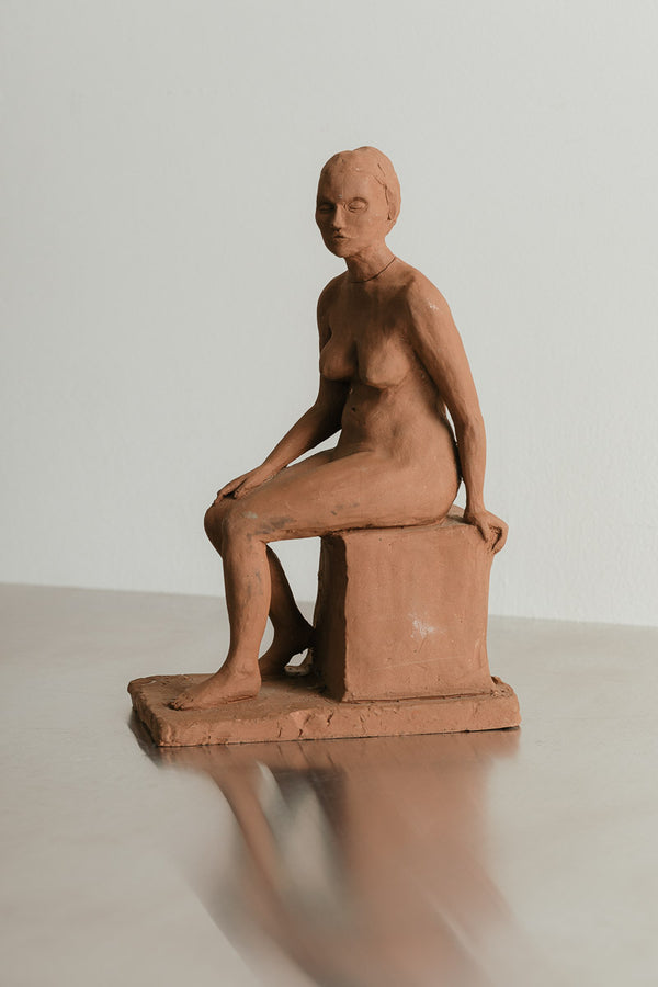 Seated Woman Sculpture